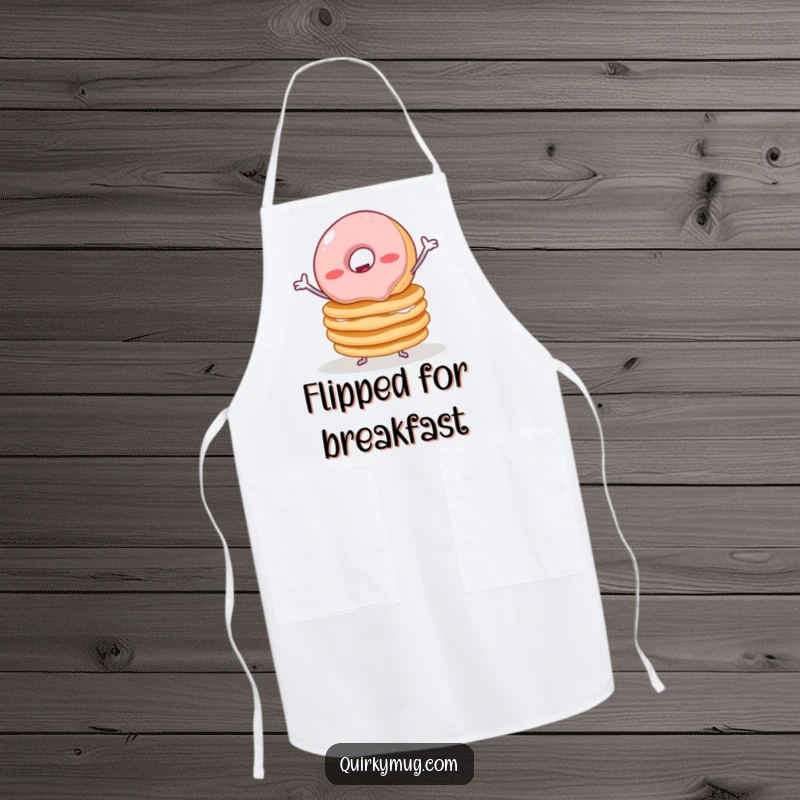 Funny apron depicting a wobbly jelly donut with tiny arms struggling to balance a stack of pancakes, ideal for kitchen use.