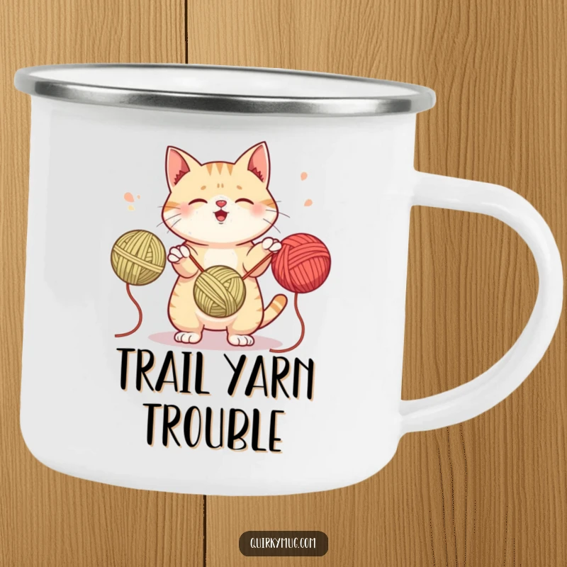 Funny camping mug featuring a mischievous cat attempting to juggle yarn balls, perfect for outdoor sips and playful humor.