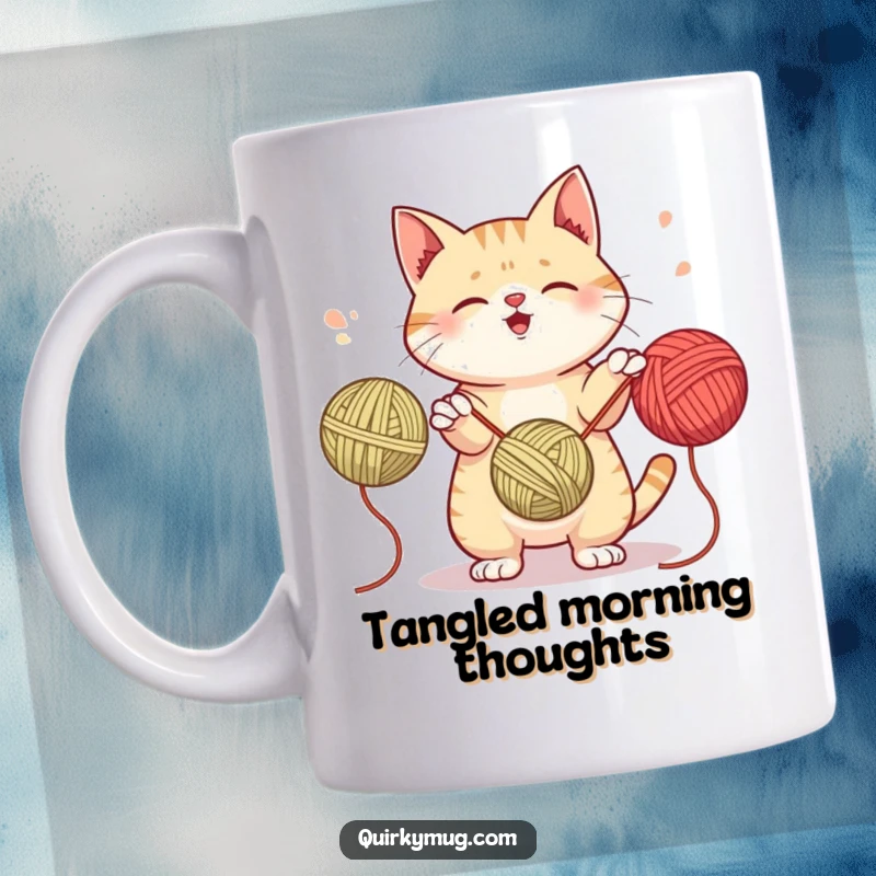 Funny mug showing a mischievous cat energetically attempting to juggle three colorful yarn balls all at once.