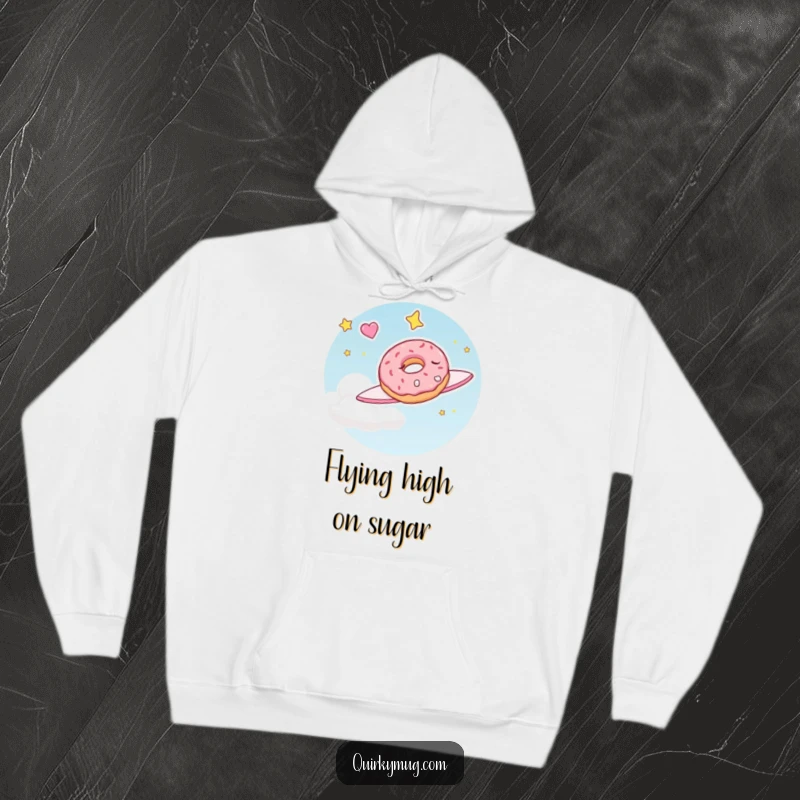 Funny hoodie featuring a sleepy doughnut character happily dreaming of flying through the sky, combining warmth with sweet fantasy.