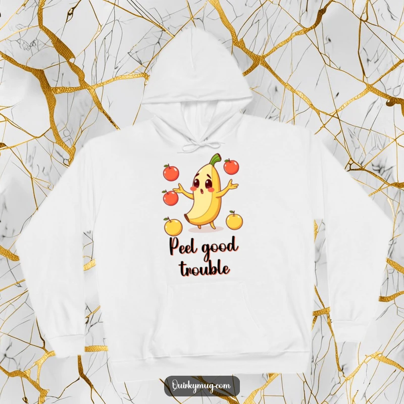 Funny hoodie featuring a surprised banana character slipping on its peel while clumsily juggling apples.