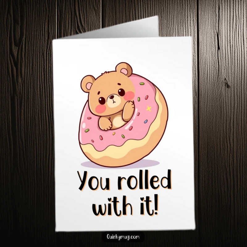 Funny Free Printable Congrats Card: Bear comically tripping over a giant rolling donut, perfect for congratulations.