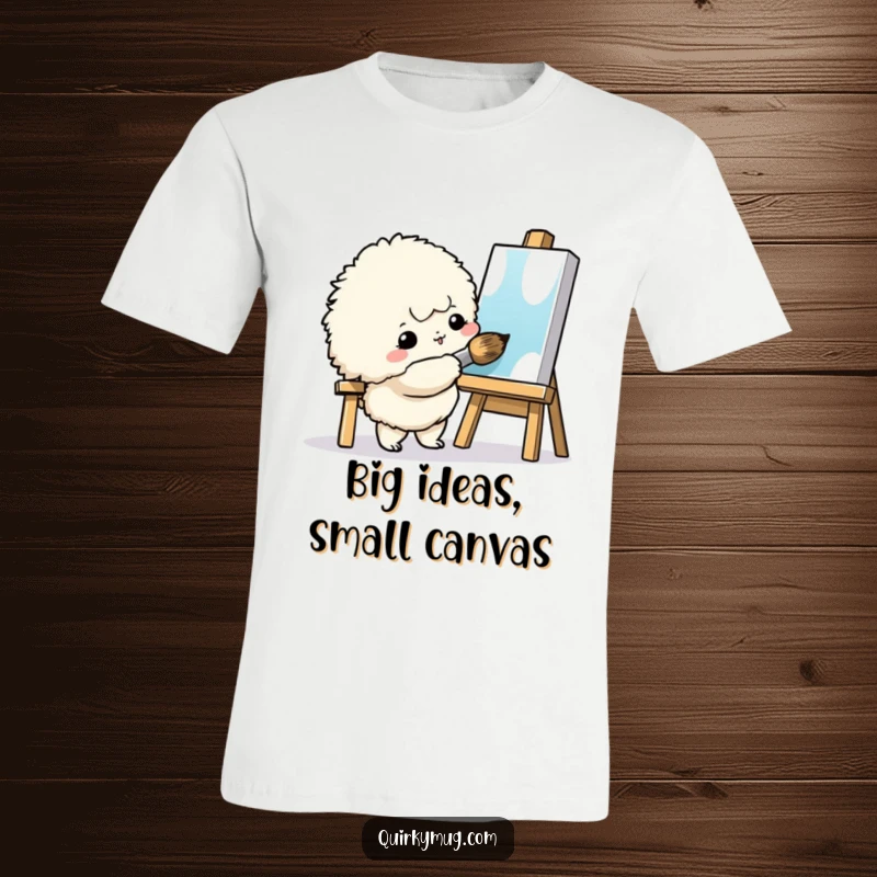 Funny Painter Creature T-Shirt: A fluffy creature enthusiastically painting a tiny canvas with a giant brush, a humorous outfit.