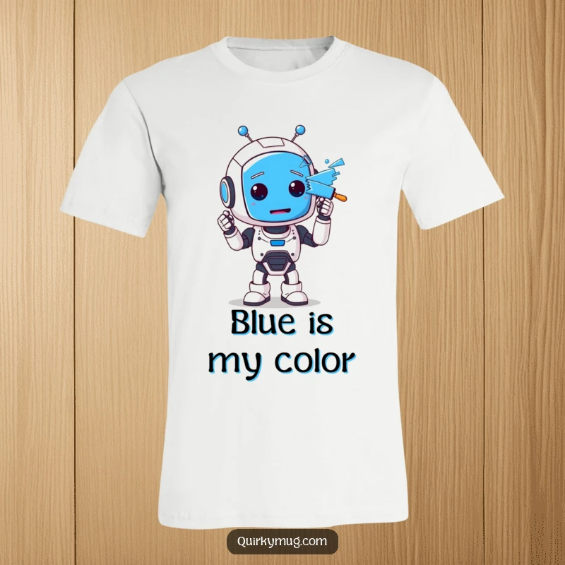 Funny t-shirt featuring a lovable, clumsy robot character with big eyes, completely painted blue from an artistic mishap, looking startled.