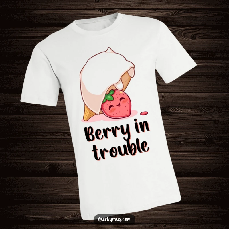 Funny t-shirt illustrating a shy, blushing strawberry character peeking out from under a giant, overturned ice cream cone, radiating cuteness.